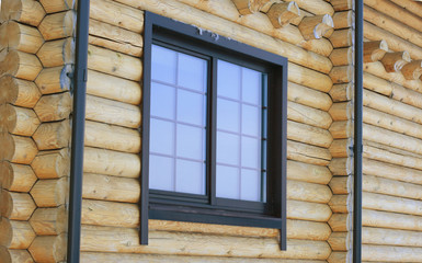 Modern window in the new wooden house