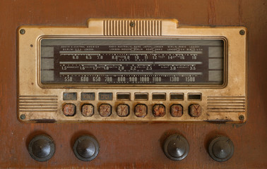 Dirty faceplate of an antique radio.