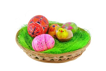Easter eggs in basket on white background