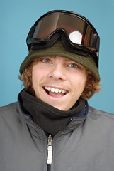 Portrait of a teenage snowboarder in all the winter gear 