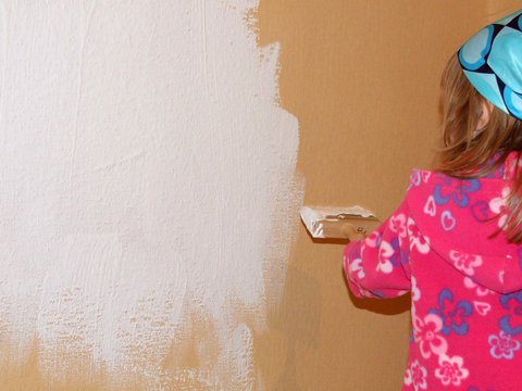 painting with white paint littelt girl