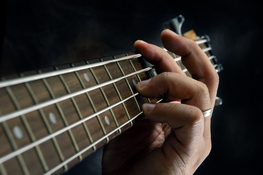 Hand of a guitarist.