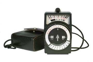 Old light meter and its case isolated on white background.