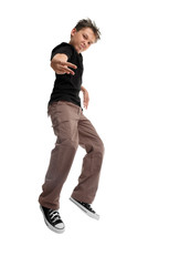 Naklejka premium Boy in urban clothes jumping off the ground with attitude.