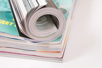 curled magazined on stack