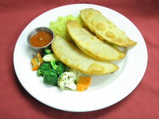 Georgian lamb pastries, rice pilaf and vegetables