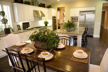 Kitchen with breakfast table and modern decor. 