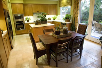 Kitchen with breakfast table and modern decor. 