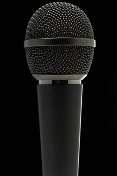 a microphone against dark background