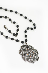 Black necklace isolated on white