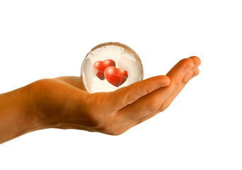 hand with two hearts in globe