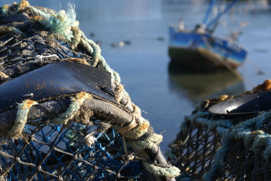 lobster keepnets & fishing boat in Brittany