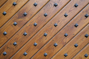 Fragment of a door with metal rivets