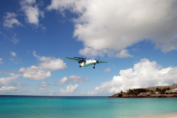 Fototapeta na wymiar Plane landing at Maho Beach Saint Martin