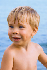 Smiley boy with water drops on face