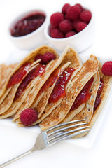 Pancakes with raspberry jam & fresh raspberries - shallow dof