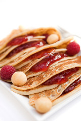 Pancakes with fresh raspberries & macadamia nuts