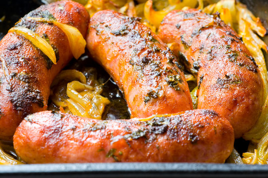 Baked pork sausages with onion and spices.