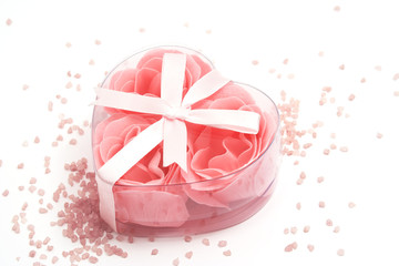 Soap foam roses in a heart-shaped box and bath salt.