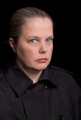 Woman with eyes open over a black background