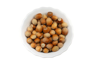 White plate with nuts isolated on a white background