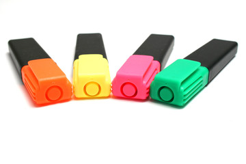 Green, yellow, orange and pink highlighters (isolated)