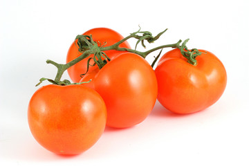 three tomatos with a bit of shadow isolated on white