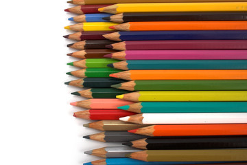 Fototapeta premium Assortment of coloured pencils with shadow on white background