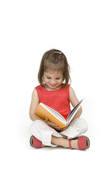 little girl reading a book