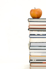 books with apple isolated on white