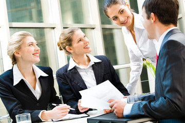 Team of business people discussing an important question