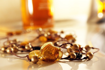 Amber heart on necklace with golden pearls - 5863289