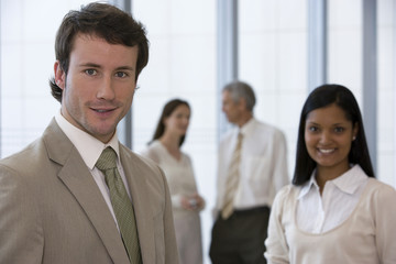 Young businessman with colleagues