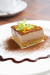 Mocca cheese cake with jam on coffee table