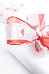 white gift box over a pink background