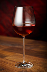 red wine glass over a dark background