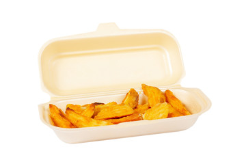 Potatoes on styrofoam container, isolated on white background