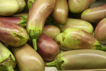 A tray of eggplants found in a market.