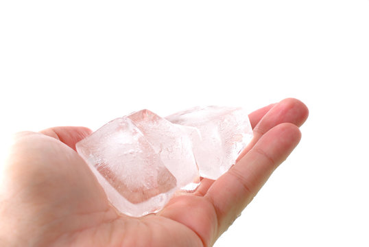 Hands holding ice cube for some drink .