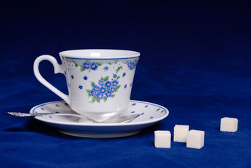 Cup of tea with sugar cube