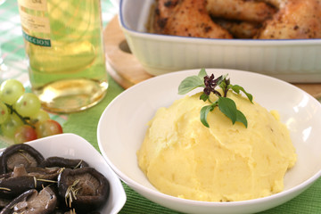 Mash potato with basil heaped up and smoothed off