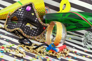 Detail of carnival with mask on color background