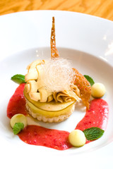 Exotic dessert of lemon toppped with baked bread