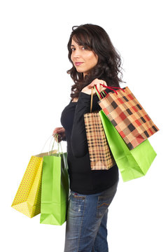 A woman holding shopping bags, isolated on white background