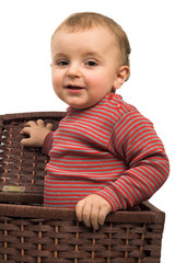 portrait of a cute baby boy in basket