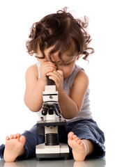 Baby with microscope.