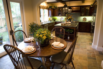 Kitchen with breakfast table and modern decor. 