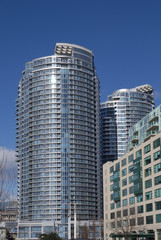 Fototapeta na wymiar Modern curved highrise condo apartment buildings