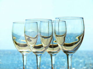 Wine glasses on a background of the sea