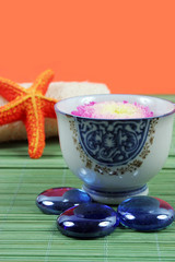 Spa and beauty products - floating flower and healing stones.